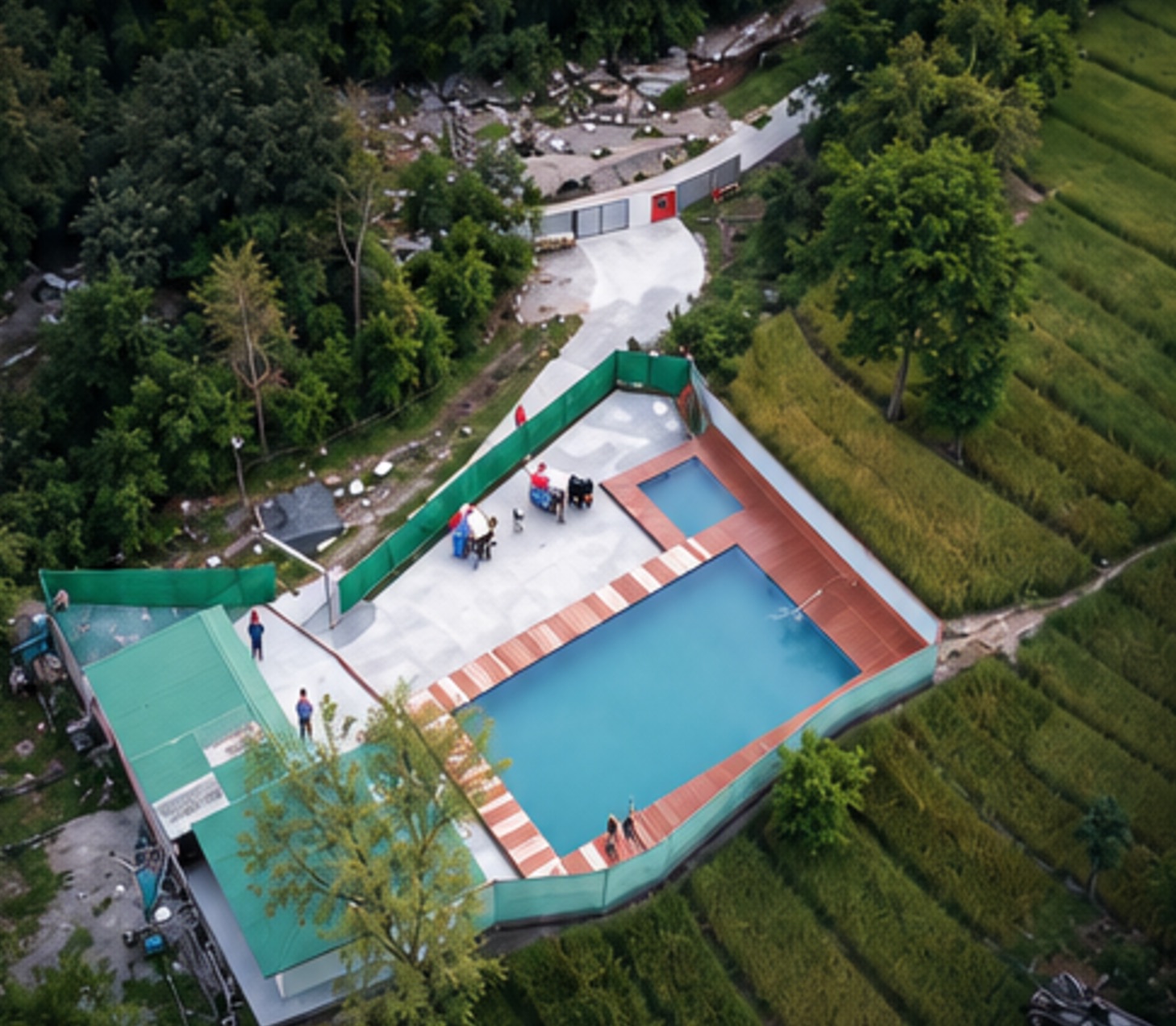 The property on its hillside, green on every side